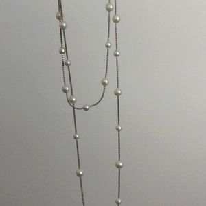 Very long silver necklace with faux peals
